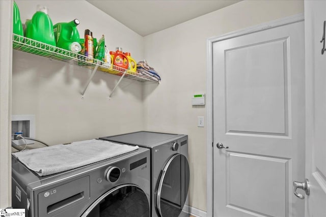 laundry room featuring washer and clothes dryer