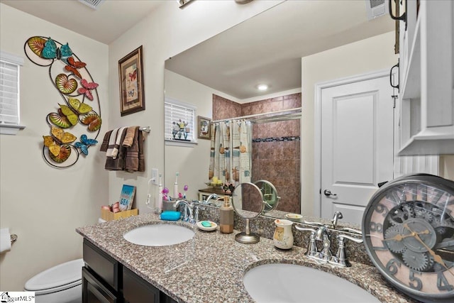 bathroom with a shower with curtain, vanity, and toilet