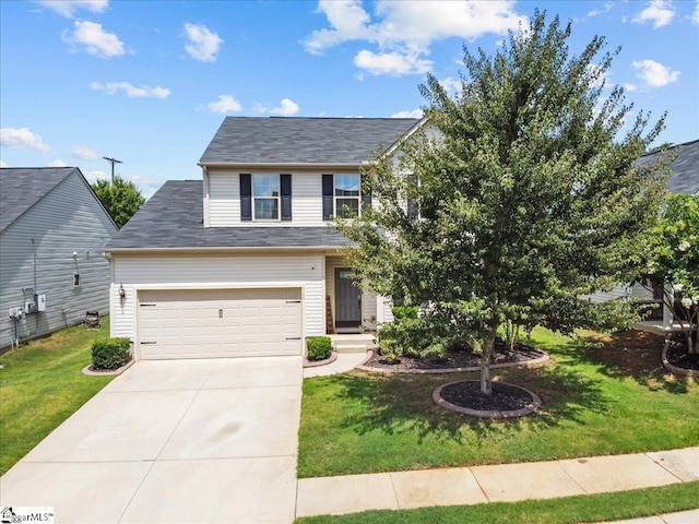 view of front of property with a front yard and a garage