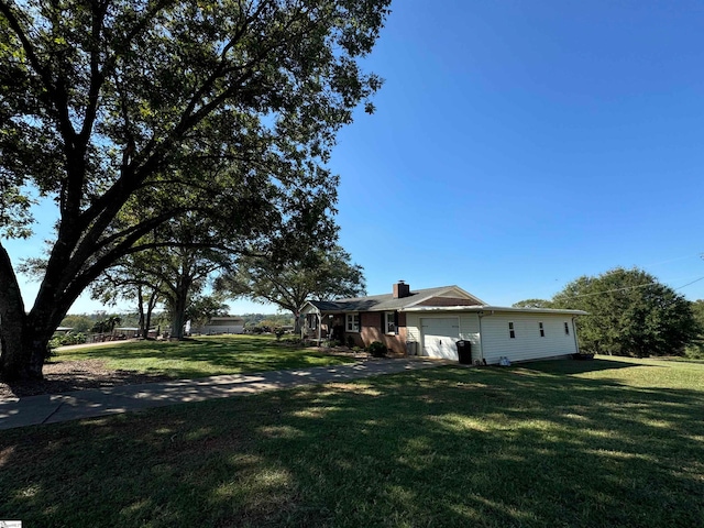 view of yard featuring a garage