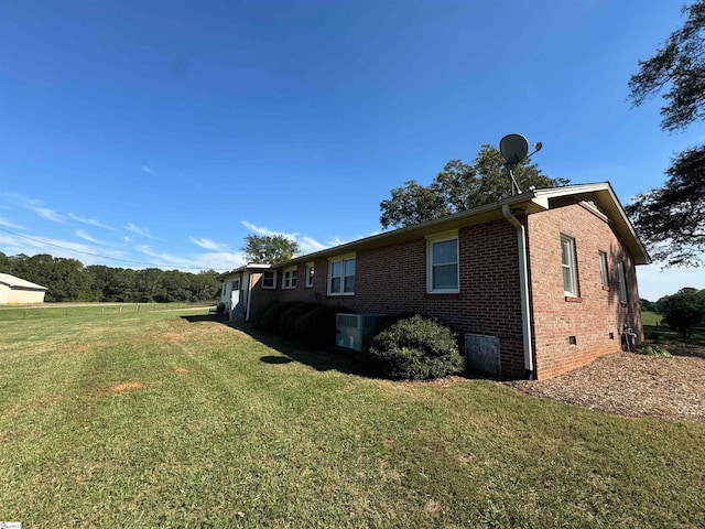 view of property exterior featuring a lawn