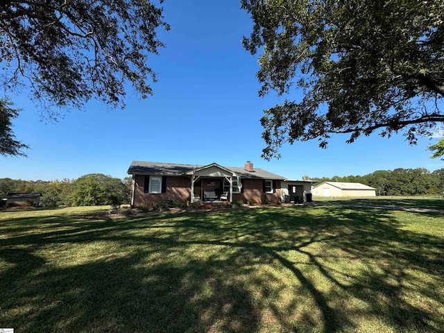 ranch-style house featuring a front lawn