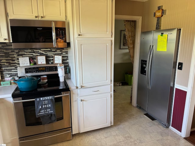 kitchen featuring appliances with stainless steel finishes and decorative backsplash