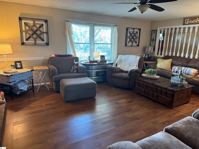 living room with ceiling fan, dark wood-type flooring, and a textured ceiling