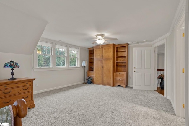 bedroom with light carpet, crown molding, and ceiling fan