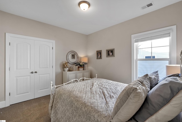 bedroom with carpet floors and a closet