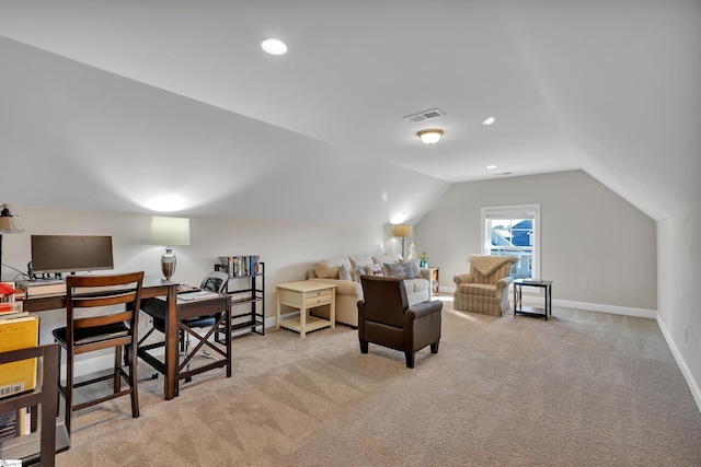 office space featuring light colored carpet and lofted ceiling