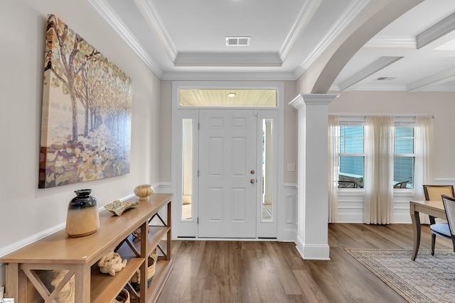 entryway featuring ornate columns, hardwood / wood-style floors, coffered ceiling, beam ceiling, and ornamental molding