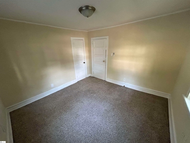 carpeted spare room with ornamental molding