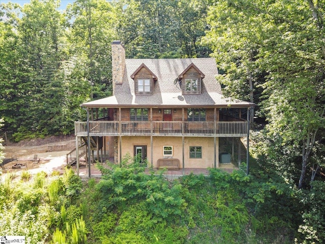 exterior space featuring a wooden deck and cooling unit