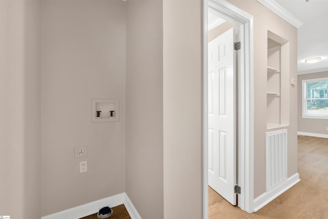 laundry room with washer hookup, ornamental molding, light hardwood / wood-style floors, and electric dryer hookup