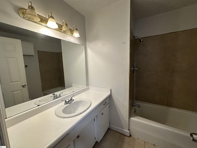 bathroom with tile patterned flooring, vanity, and bathtub / shower combination