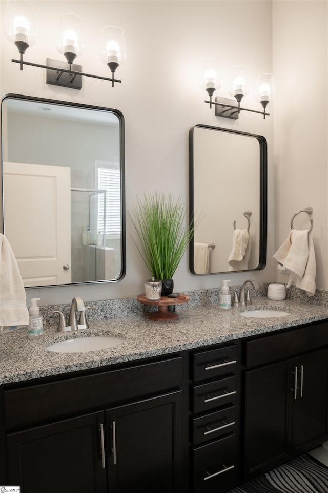 bathroom with vanity and an enclosed shower