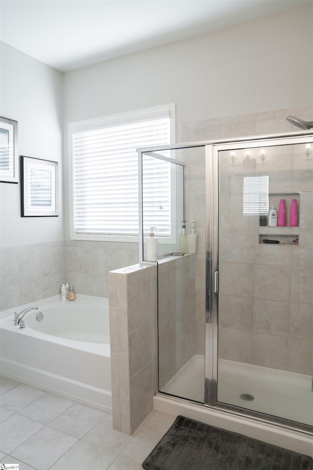 bathroom featuring separate shower and tub and tile patterned floors