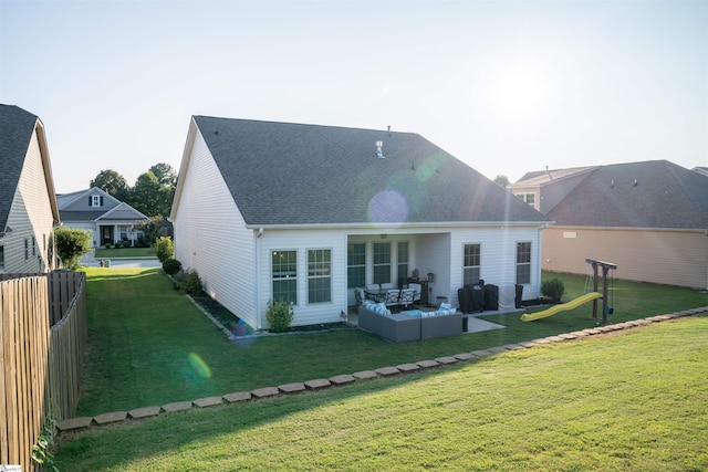 back of property featuring a yard, outdoor lounge area, and a patio