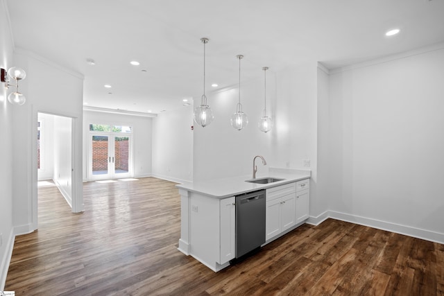 kitchen featuring dark wood-type flooring, sink, stainless steel dishwasher, and white cabinets