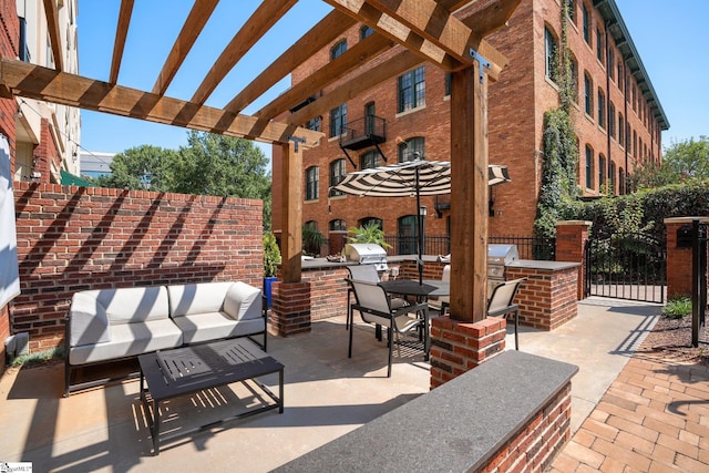 view of patio featuring area for grilling and a pergola