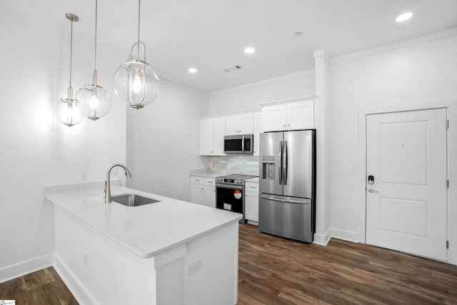 kitchen featuring appliances with stainless steel finishes, sink, white cabinetry, decorative light fixtures, and dark wood-type flooring