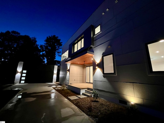 view of property exterior at night