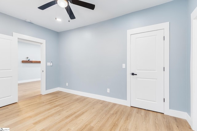 unfurnished room featuring light wood-type flooring and ceiling fan