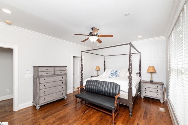 bedroom with dark wood-type flooring, crown molding, and ceiling fan