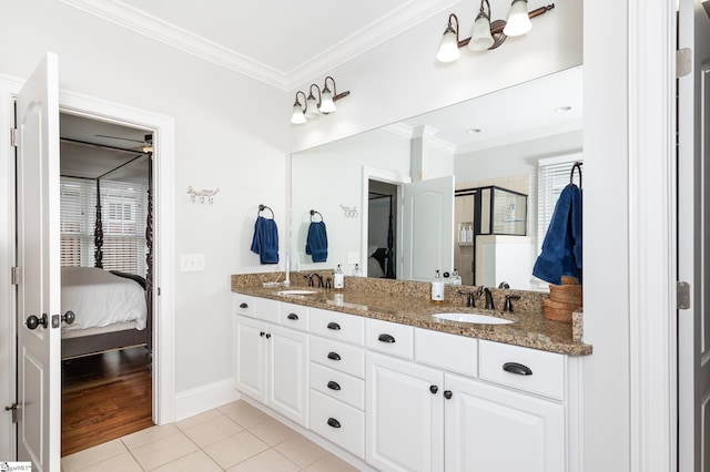 bathroom with vanity, crown molding, wood-type flooring, and a shower with shower door