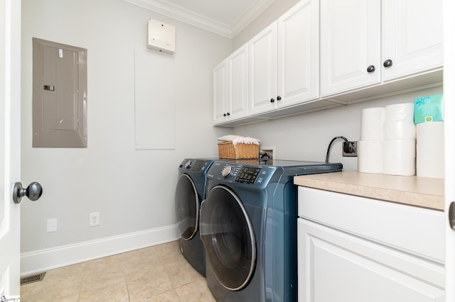 clothes washing area with crown molding, cabinets, electric panel, and separate washer and dryer