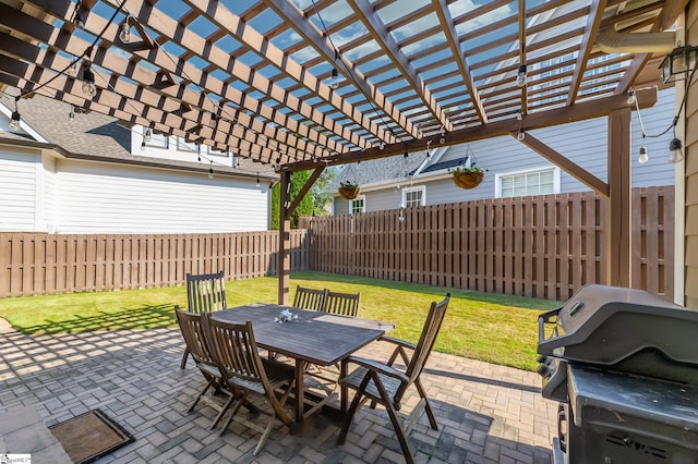 view of patio featuring area for grilling and a pergola