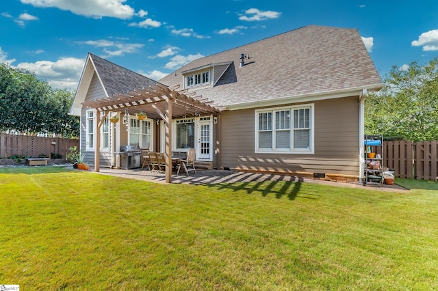 rear view of property with a pergola, a patio, and a yard