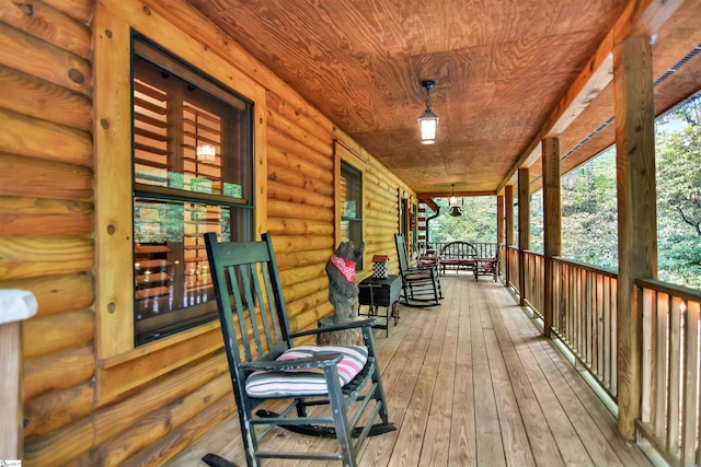 wooden terrace featuring a porch