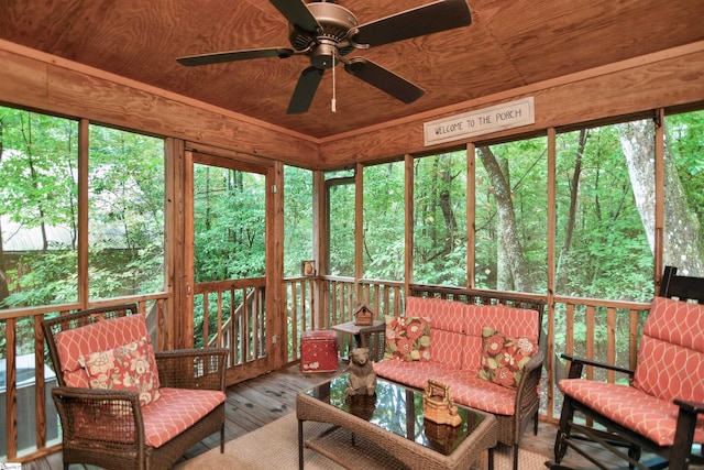 sunroom / solarium with wooden ceiling and ceiling fan