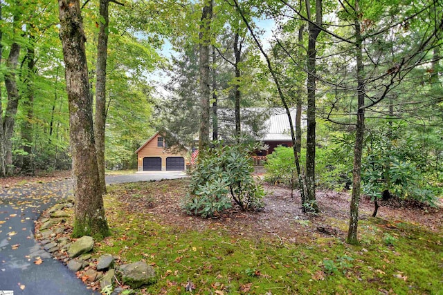 view of yard featuring a garage