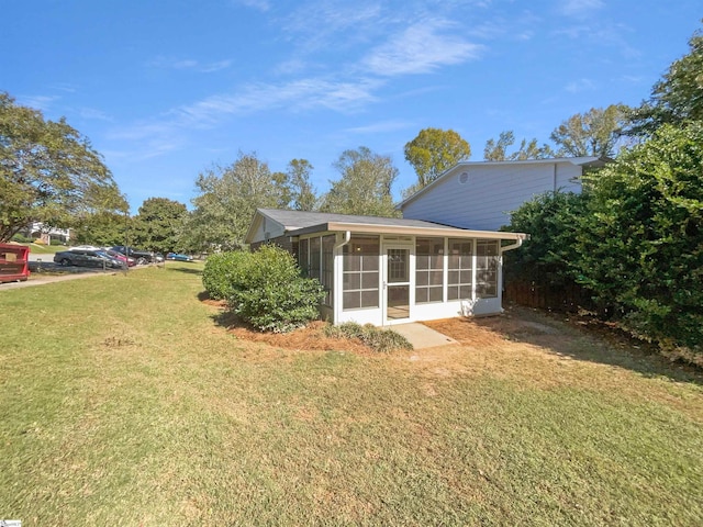 view of yard with a sunroom