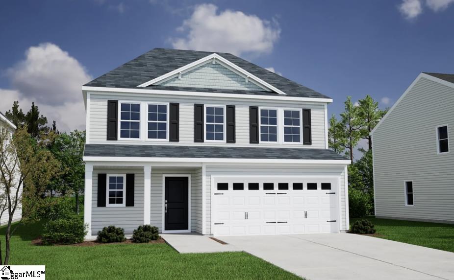 view of front facade with a front lawn and a garage