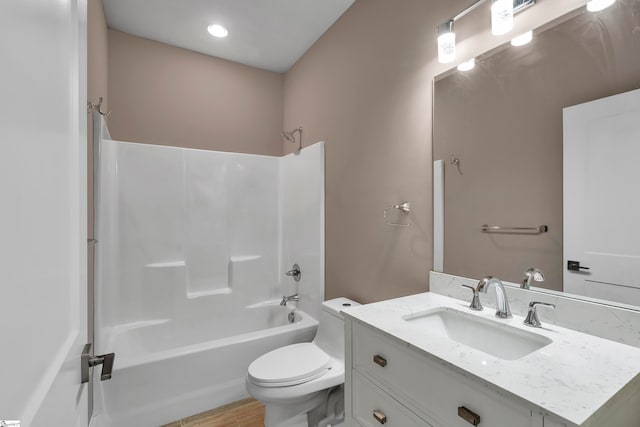 full bathroom with vanity, bathing tub / shower combination, and toilet