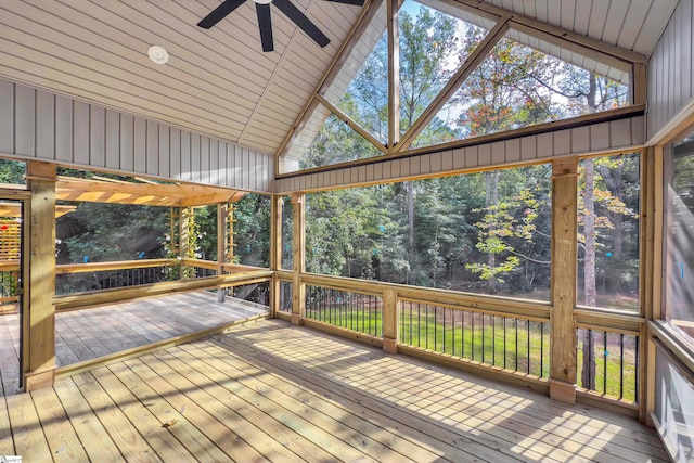 unfurnished sunroom featuring ceiling fan and vaulted ceiling