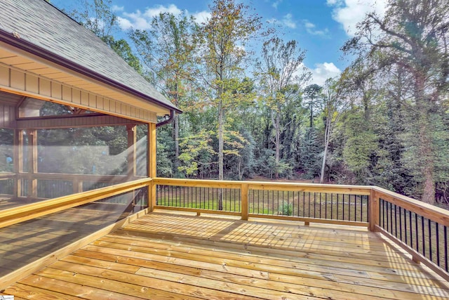 wooden deck featuring a sunroom