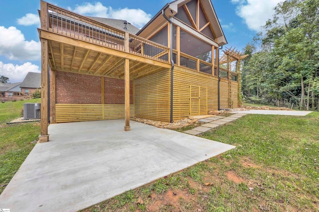 view of patio / terrace with a wooden deck and central AC unit