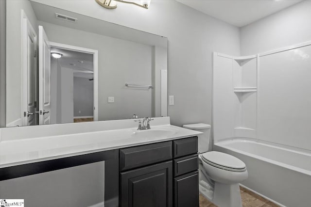 full bathroom with vanity, toilet, and shower / tub combination