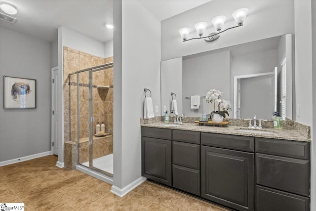 bathroom with vanity, tile patterned floors, and walk in shower