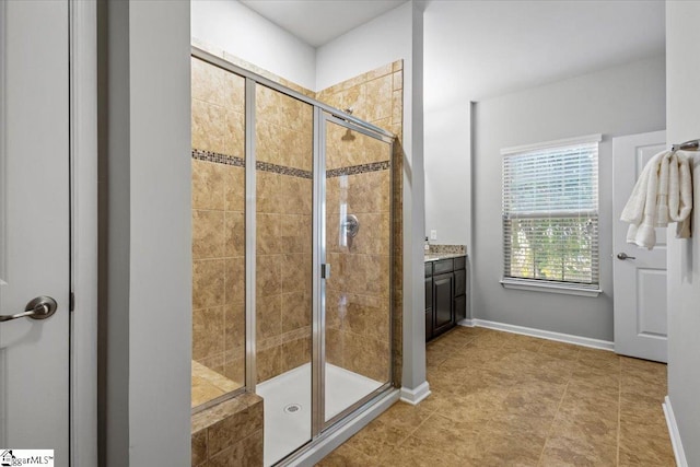 bathroom with vanity, tile patterned floors, and walk in shower