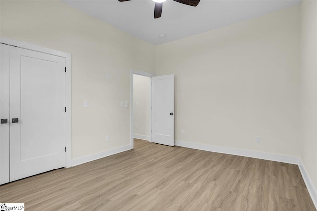 unfurnished bedroom with a closet, ceiling fan, and light hardwood / wood-style flooring