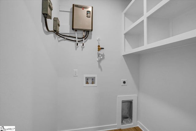 clothes washing area featuring hookup for a washing machine, hardwood / wood-style flooring, and electric dryer hookup