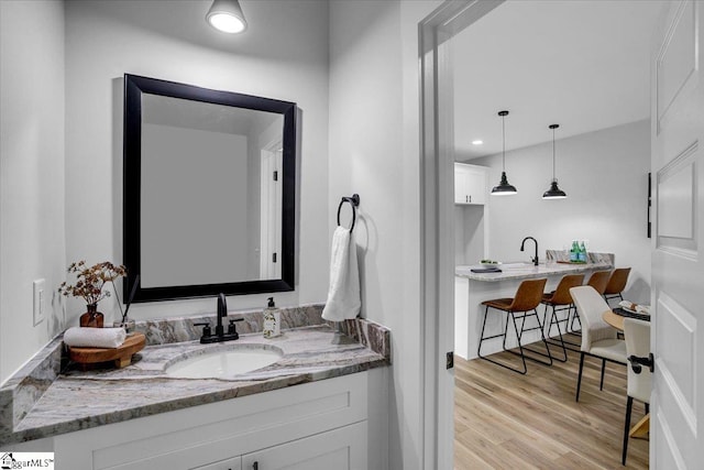 bathroom featuring vanity and hardwood / wood-style flooring