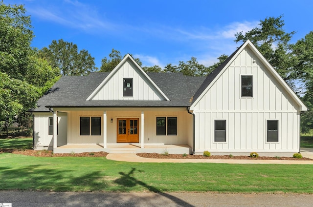 view of front of property with a front yard and a porch