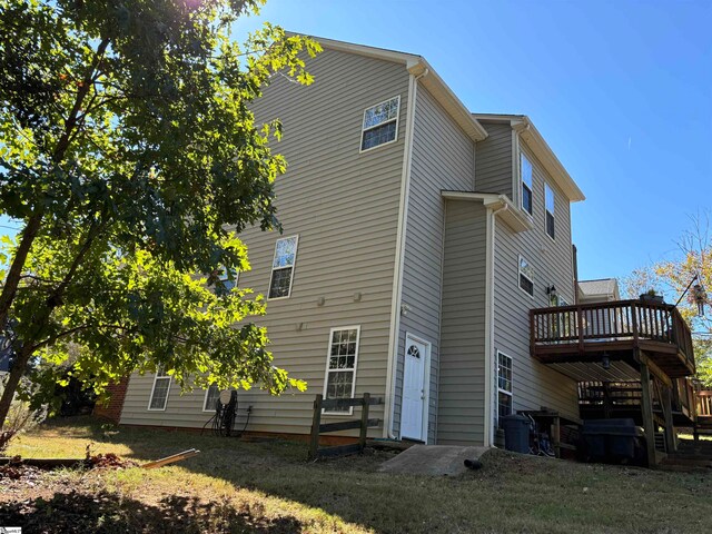 back of property with a wooden deck