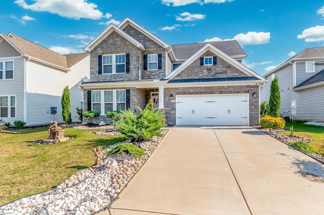 craftsman-style house featuring a front lawn and a garage