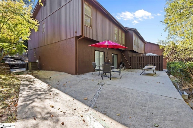 back of house featuring central air condition unit and a patio area