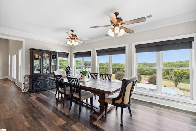 3560 Pelzer Hwy, Easley, SC 29642 - dining area featuring a ceiling fan, dark wood-style floors, crown molding, and baseboards