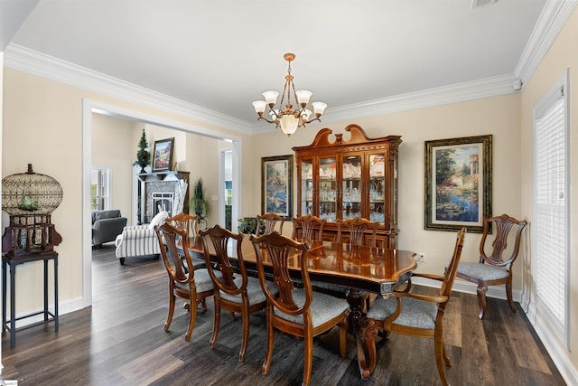 dining room with a notable chandelier, dark hardwood / wood-style floors, and crown molding